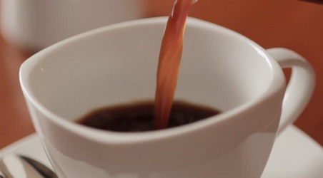 Pour coffee in a cup